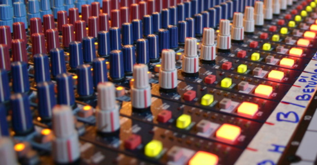 Photo of a mixing board in a recording studio